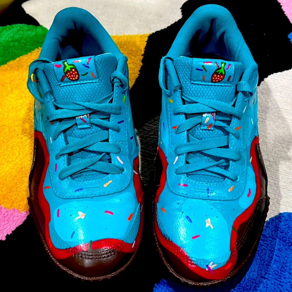 Gently used puma shoes for men custom made with blue brown and red